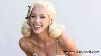 Alix Earle puffs on a cigarette in platinum blonde wig and tiny mini dress during pinup photo shoot