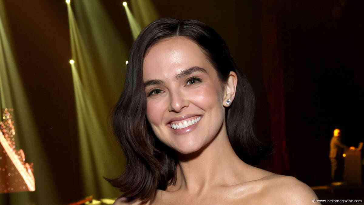 Zoey Deutch shows off impeccably toned abs in black bikini in new photos