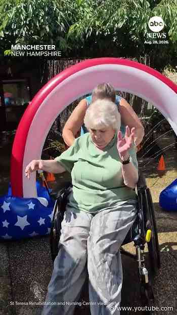 Nursing home residents beat the heat with wheelchair 'car wash'