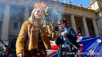 Deplorable scenes at anti-immigration rally as sacked comedian pokes fun at Aboriginal culture - and protesters are arrested during clashes with police