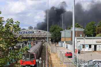 Third day of Tube disruption as 'toxic air' from huge blaze near Wembley Stadium prevents trains running