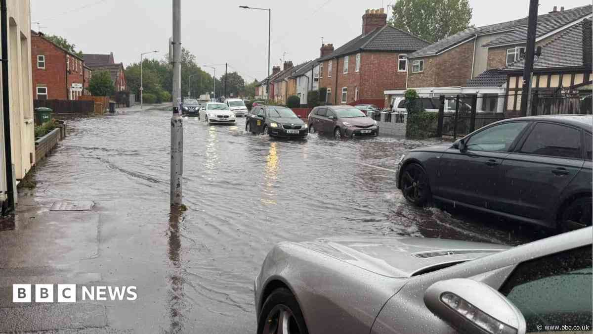 City streets hit by flooding after heavy downpours