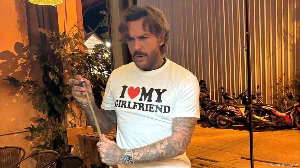 Olivia Attwood shares smitten snap of boyfriend Pete Wicks in an 'I love my girlfriend' T-shirt after 'hard launching' their relationship