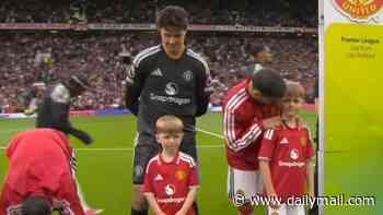 Dignity in the face of tragedy: Sons of A66 victim PC Matthew Blades walk out as mascots for Manchester United as they take on Ipswich Town