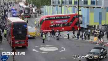 Pedestrian injured as bus crashes into building