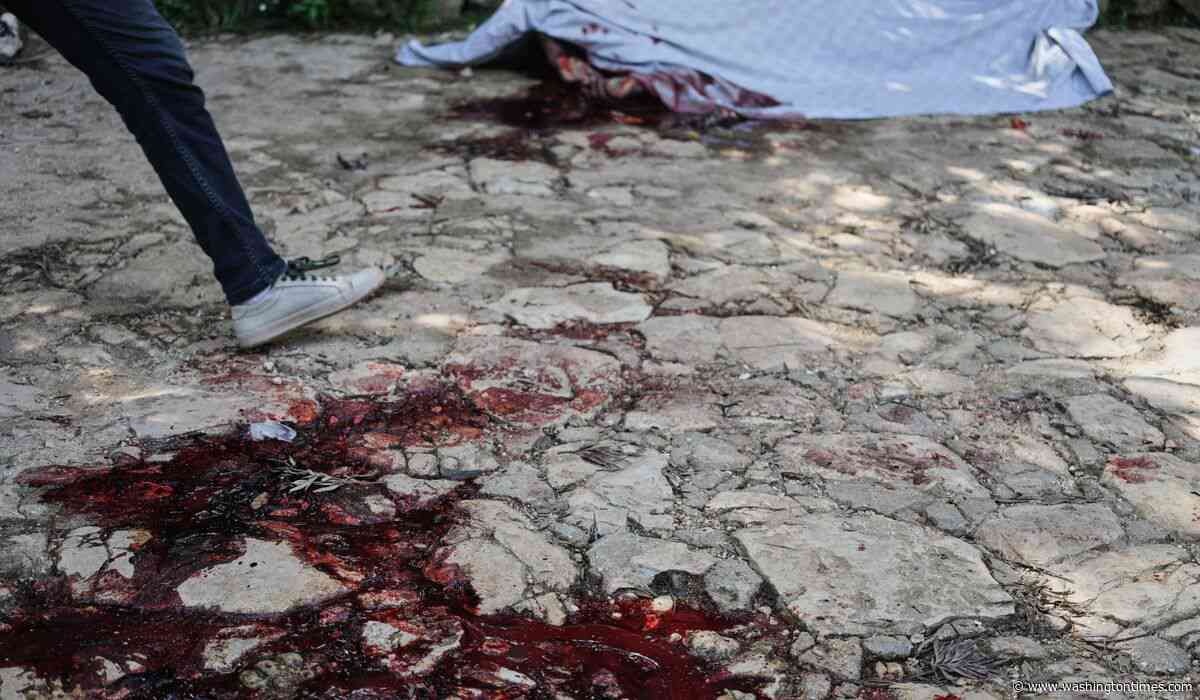 Hundreds attend funeral in Haiti for 4 victims of brutal gang attack that killed 47