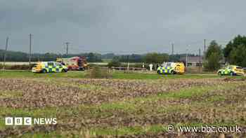 Man dies after train hits van on crossing