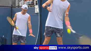 Atmane forced to serve UNDERARM with wrong hand after cramping