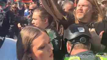 Shocking moment Channel 10 reporter is brutally shoved to the ground after anti-immigration rally erupted into violence in Melbourne