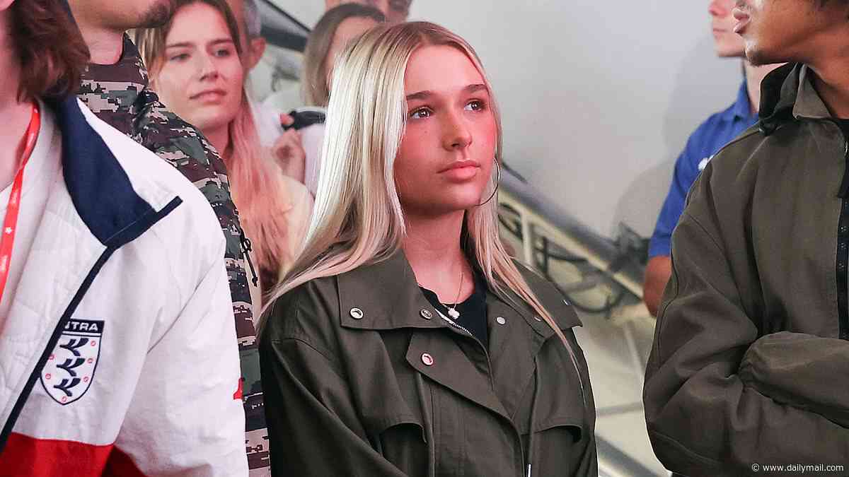 Harper Beckham's festival fashion parade: Teen teams denim hotpants and a crop top with a £2,500 necklace, £120 wellies and a £130 GAP jacket by mum Victoria as she watches Cruz perform at Reading