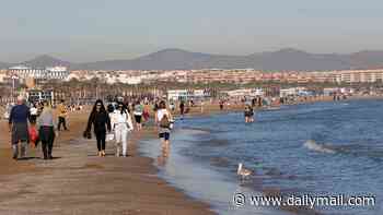 Woman, 22, is 'raped by illegal migrant on Spanish beach' after she went for an early morning swim