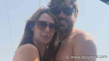 The One Show host Alex Jones cuddles shirtless husband Charlie Thomson as she opens up her holiday photo album from family sailing trip
