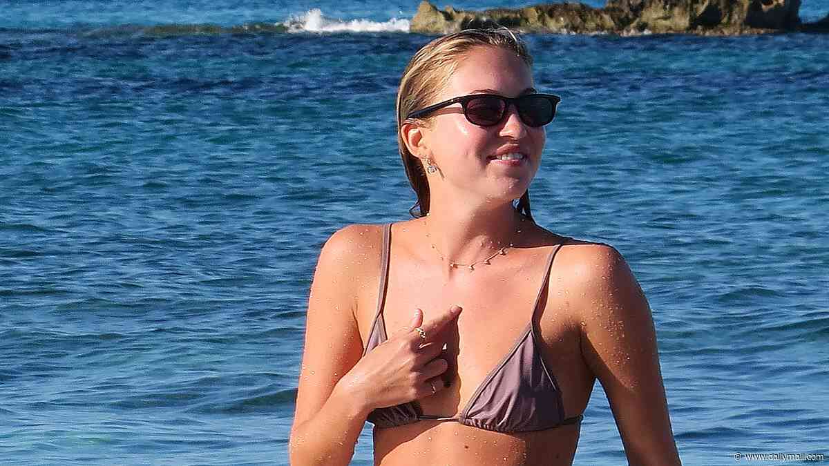 Lila Moss looks just like model mum Kate as she sports a tiny bikini on the beach in Formentera