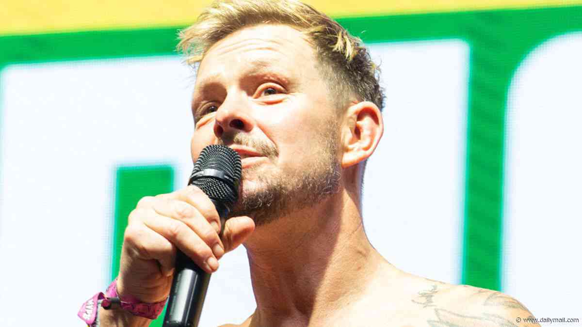 Coronation Street star Adam Rickitt, 48, proves he's still got soap heartthrob status as he shows off his muscular six-pack while performing at Manchester Pride