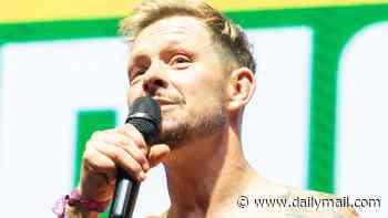 Coronation Street star Adam Rickitt, 48, proves he's still got soap heartthrob status as he shows off his muscular six-pack while performing at Manchester Pride