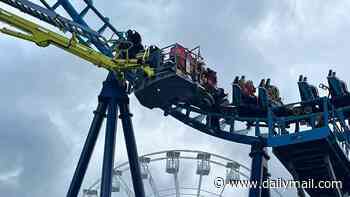 Twenty-seven people are trapped on 'Wipeout' rollercoaster 50ft in the air for more than three hours at Suffolk theme park