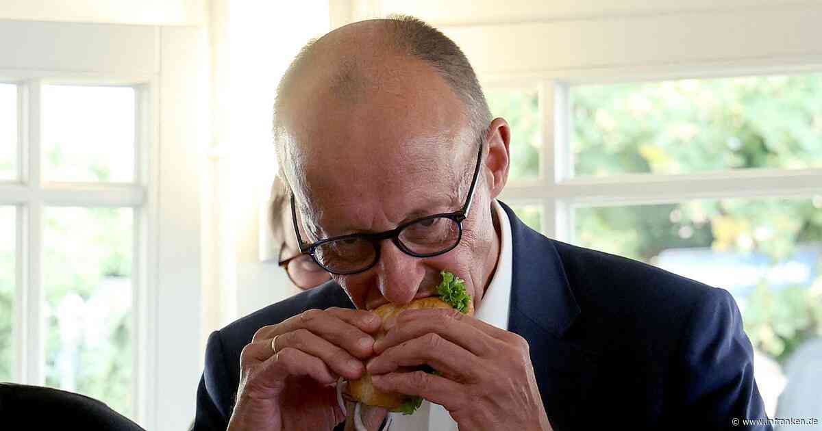 Fischbrötchen, Pfiffe und eine Warnung - Merz im Wahlkampf