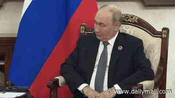 Awkward moment squirming Putin is told to 'move from endless war to the end of war' in meeting with India's PM Modi