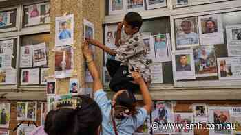 ‘My heart is aching’: Wall of the missing lays bare desperate race to find Nepal victims