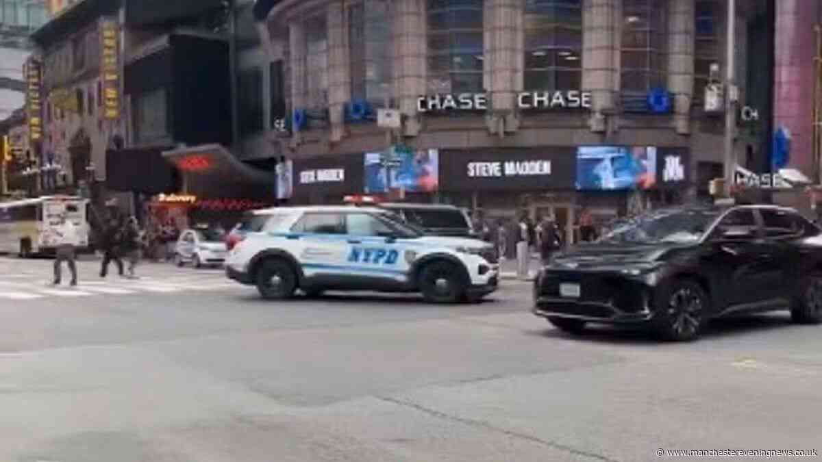 Woman shot by police in Times Square after two stabbed in robbery