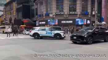 Woman shot by police in Times Square after two stabbed in robbery