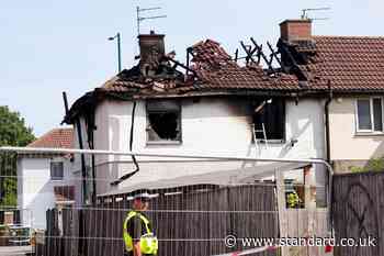 Man, 23, charged with two counts of murder after fatal house fire