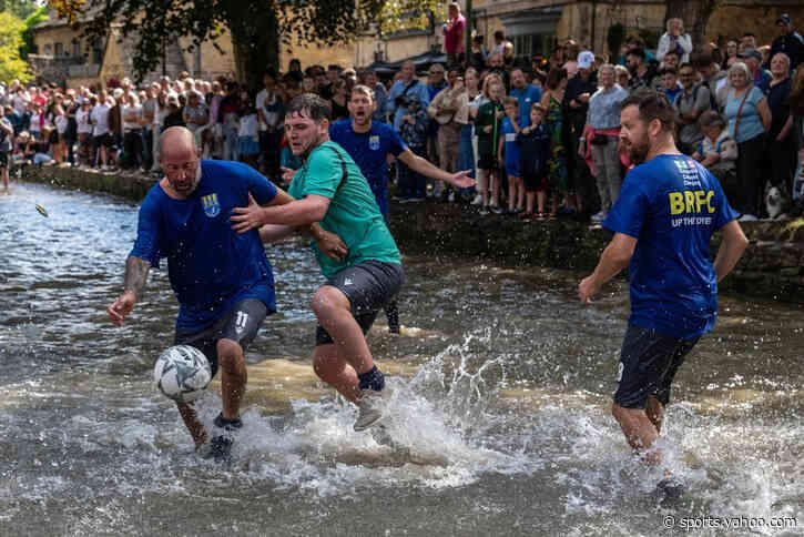 Hundreds flock to the Cotswolds village to watch bizarre football match in river