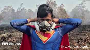 Why is this teenager fighting fires dressed as Superman?