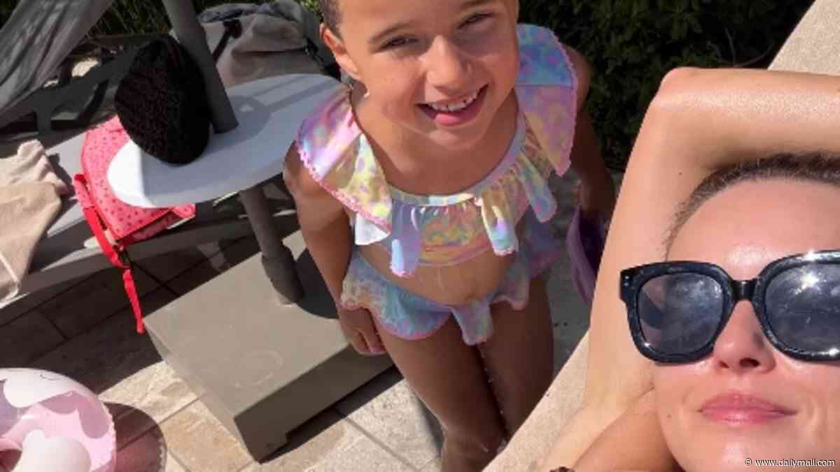 Ola Jordan shows ex James what he's missing as she poses in a leopard print bikini while getting used to life as a single mum on holiday with daughter Ella after 'incredibly tough' split