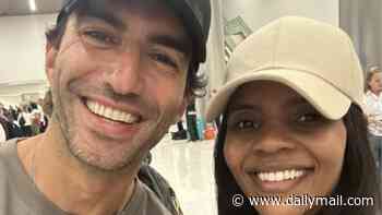 Candace Owens cuddles up to Justin Baldoni after meeting in an airport... and trolls Blake Lively by sharing selfie set to Taylor Swift anthem