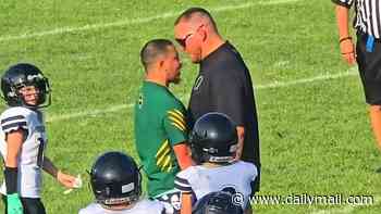 Crazed youth football coach tackles rival and smacks woman as wild on-field brawl breaks out in front of third graders