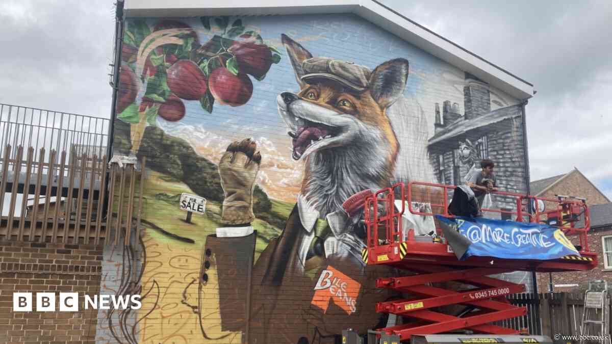 Mural on shop wall celebrates community heritage