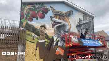Mural on shop wall celebrates community heritage