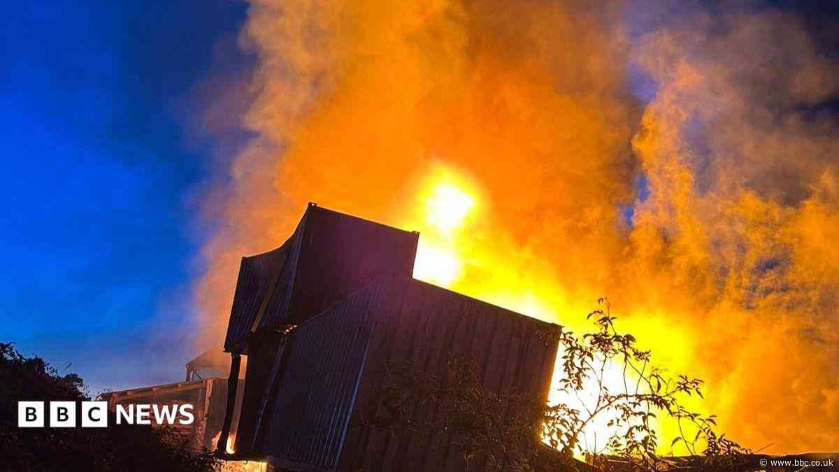 Huge recycling centre blaze 'caused by battery'