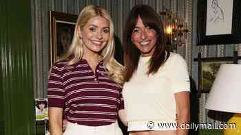 Beaming Holly Willoughby and Davina McCall wrap their arms around each other in friendly snap as they catch up at a hair care event