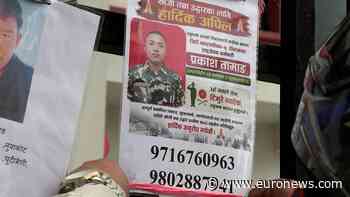 Nepal families post photos of missing relatives on Kathmandu hospital wall