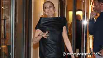 Celine Dion looks giddy as she returns to her hotel as she prepares to kick off her Paris residency after dancing in the street
