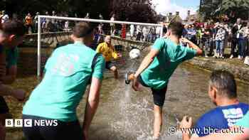 Hundreds gather to watch river football match