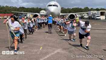 Plane pullers help charity push towards £500k