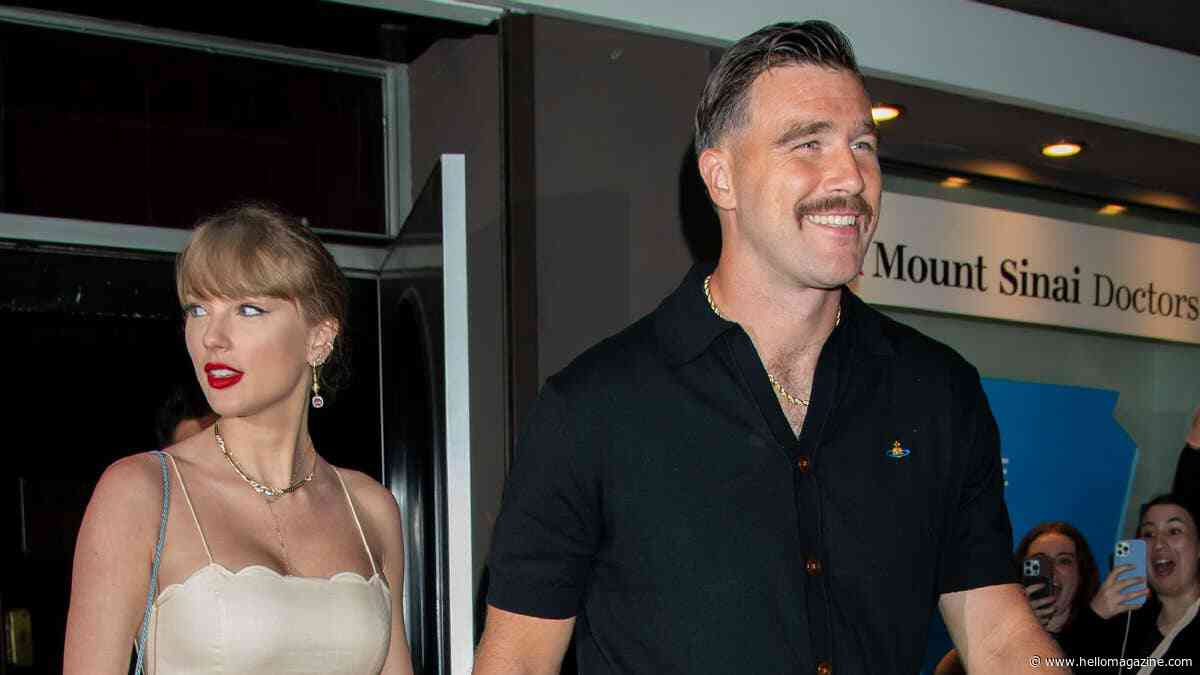 Travis Kelce lifts Taylor Swift up in unseen wedding photo