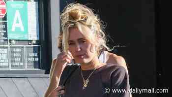 Grief-stricken Miley Cyrus steps out one week after death of godmother Dolly Parton
