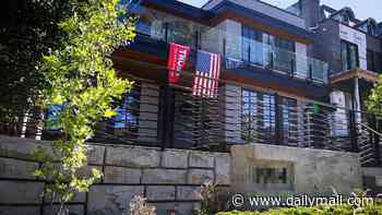 Canadian mansion covered in MAGA flags is vandalized as woke locals call for it to be torched