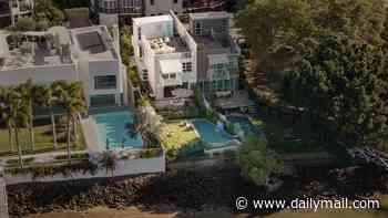 High society feud erupts in Brisbane's 'Millionaire's Row' over 16m pontoon outside luxury $5.9m mansion