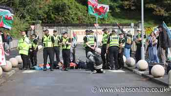 Protestors glue themselves to road outside Wales' most famous hotel