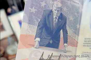 Eric Trump shows off his new passport featuring dad’s glowering image
