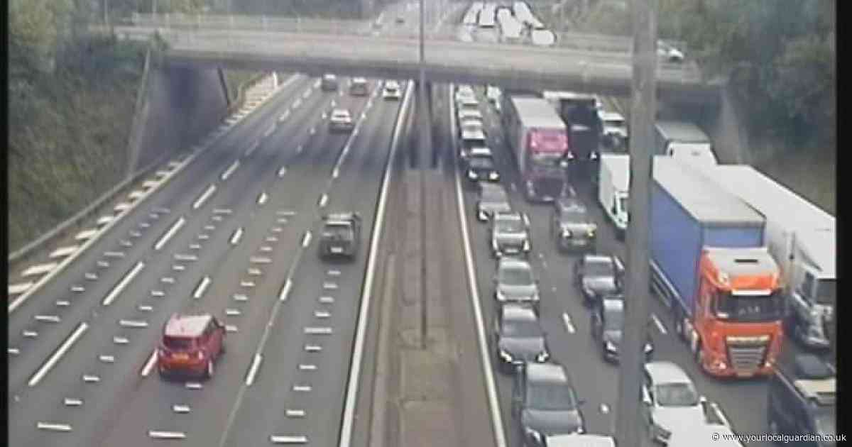 M25 shut by van fire and fuel spillage as queues stretch for six miles