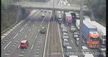 M25 shut by van fire and fuel spillage as queues stretch for six miles
