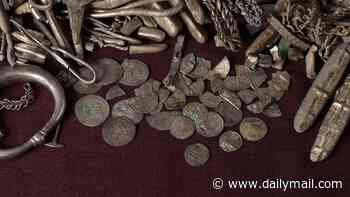Homeowner finds Denmark's biggest ever haul of Viking silver while digging up his garden - including jewellery, coins, and even a tiny Thor's hammer