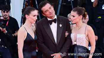 Sisters Rooney and Kate Mara pose with onscreen lover Orlando Bloom at the Bucking Fastard premiere in Venice as they play identical twins who spoke in unison and loved the same man