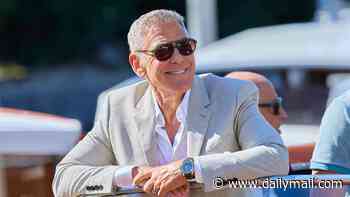 George Clooney praises lawyer wife Amal for being 'the only person to have put ISIS on trial and won' as he gives speech at Venice and takes a swipe at President Trump